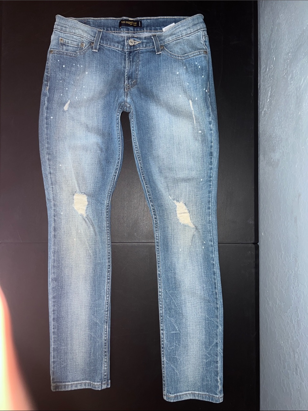 Levi's Women's Skinny Jeans in Light Blue with Distressed Knees